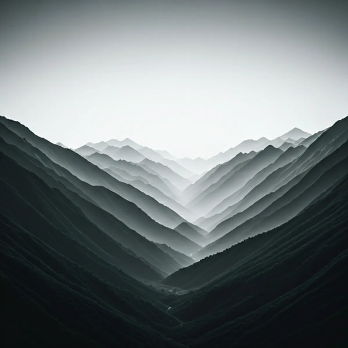 Cinematic landscape shot showing misty mountains in monochrome tones representing scope and vision